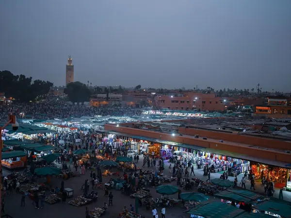 Marrakech, Jemaa el-Fnaa at dusk with the Koutoubia