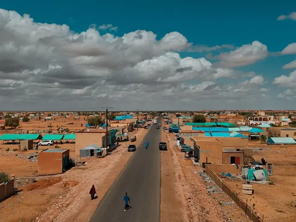 Paved highway through a Mauritanian desert town