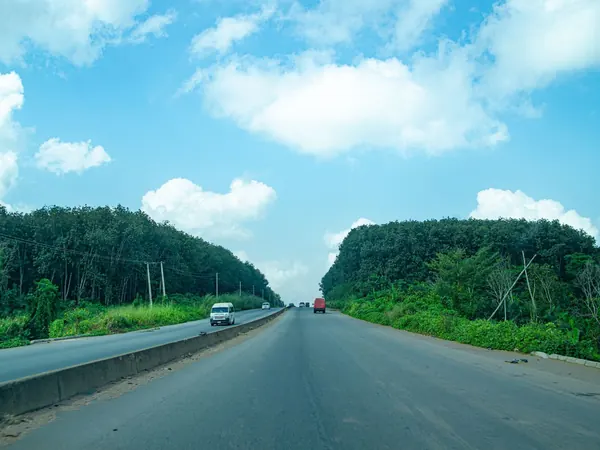 Highway through the forest east of Lagos, towards Benin City