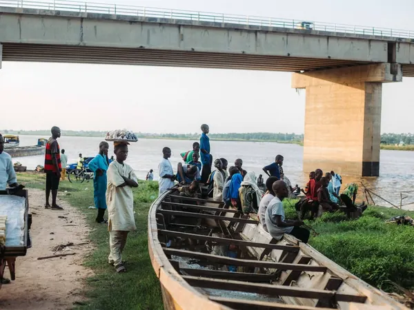 Riverside life under a bridge on the Niger