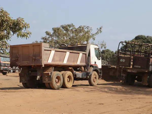 Timber trucks in Dolisie, setting off along the RN1 corridor