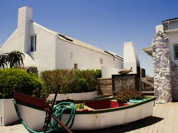 Paternoster, whitewashed fishermen's cottages and boat
