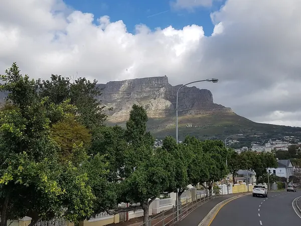 Riding into Cape Town beneath Table Mountain (Kloof Nek Road)