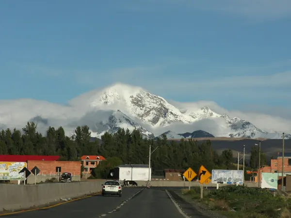 Road into El Alto across the Altiplano, Huayna Potosí behind
