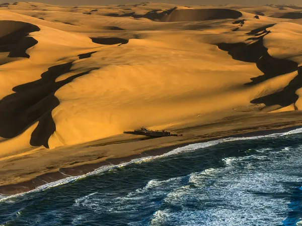 Skeleton Coast, dunes meeting the Atlantic