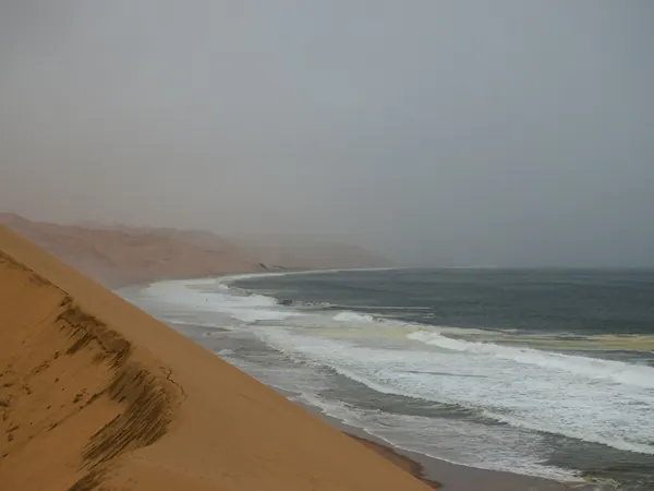 Dunes meeting the ocean near Walvis Bay