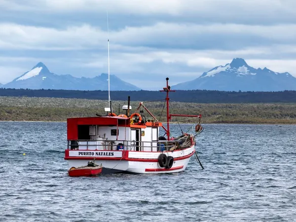 Fishing boat on Última Esperanza sound, Puerto Natales