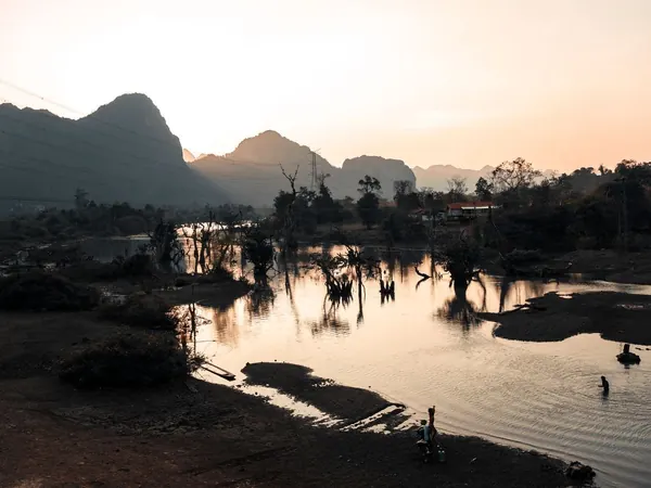 Karst peaks and flooded forest at sunset, central Laos