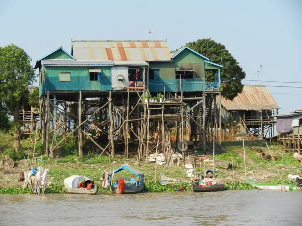 Stilt houses on a riverbank in rural Cambodia