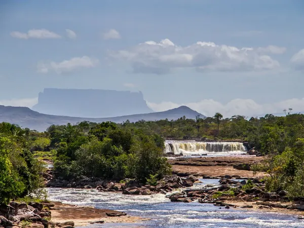 Waterfall and tepui in Canaima National Park, Gran Sabana