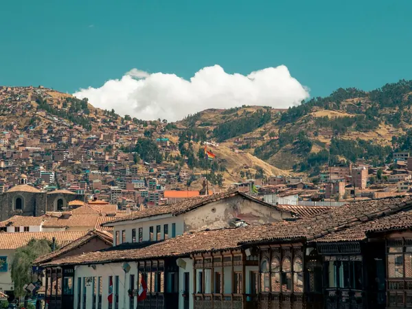 Cusco, colonial balconies and the hillside barrios above the old town