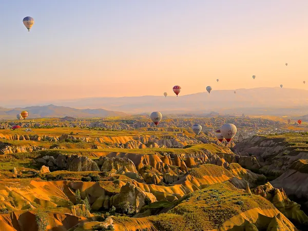 Cappadocia, hot-air balloons over the valleys at sunrise